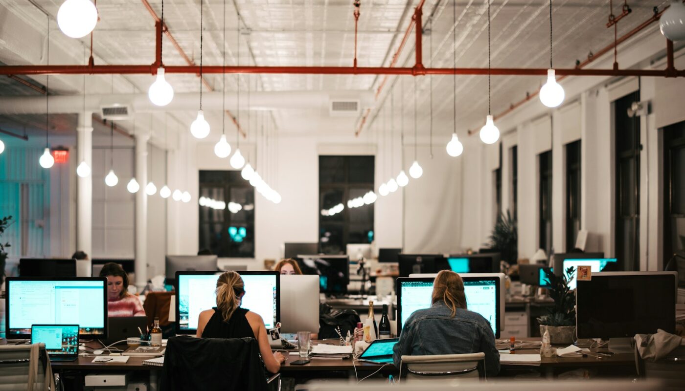 people sitting on chair in front of computer